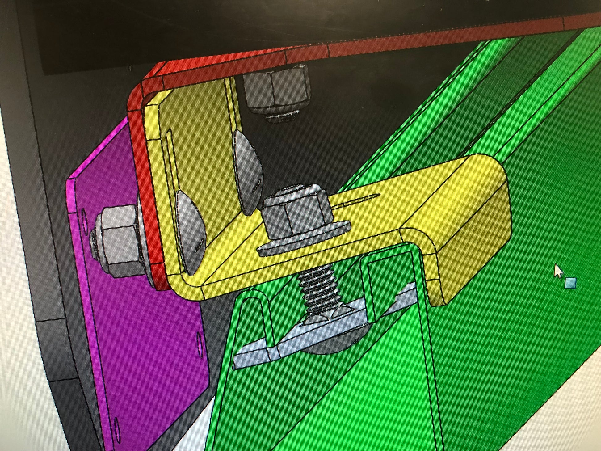 At Dmac Racks, our team designs all racks in 3D modeling software to ensure the best fit to each vehicle.  This image shows the Commander roof rail in green, and the yellow mounting bracket secured in place with the grey Dmac Rail Tab.  Vertical slots in the lower (yellow) and upper (red) brackets allow for leveling after install, as well as accommodating the arch of the roof.