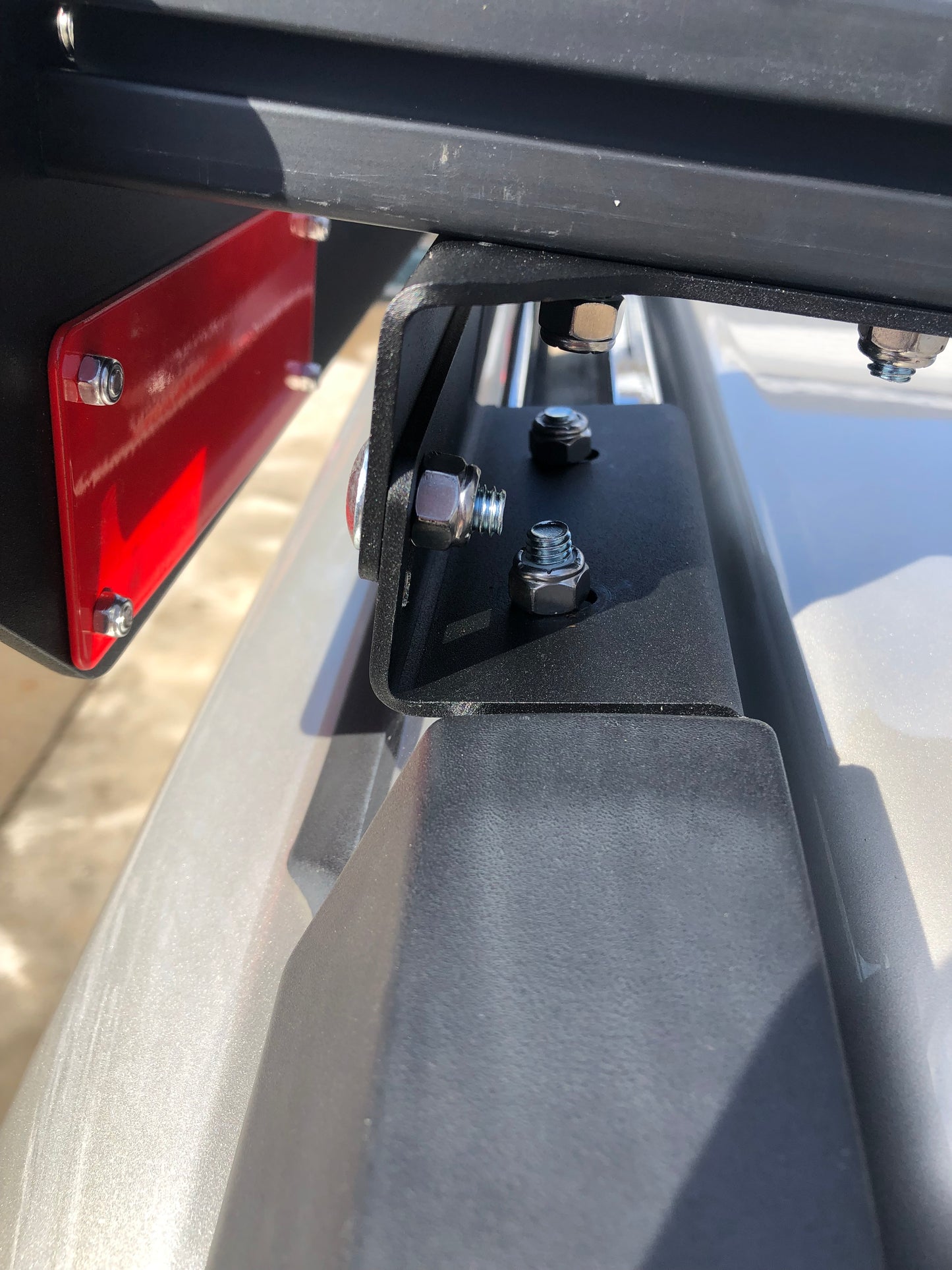 Rooftop mounting brackets attach securely to the Commander's factory rails in any location.  No drilling or modifications required for installation.